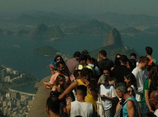 A group of people standing on top of a mountain