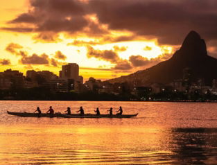 a group of people in a boat on a body of water