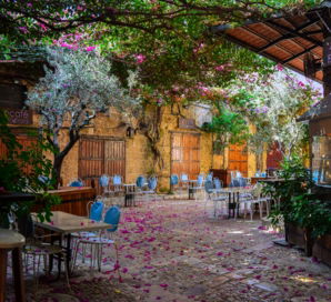 a courtyard with tables and chairs